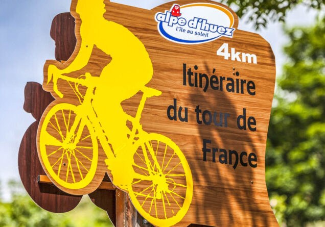 Alpe-D'Huez,France- July 18, 2013: Road indicator of the route for Tour de France located on  the road to Alpe D'Huez, in the stage 18 of the edition 100 of Le Tour de France 2013.