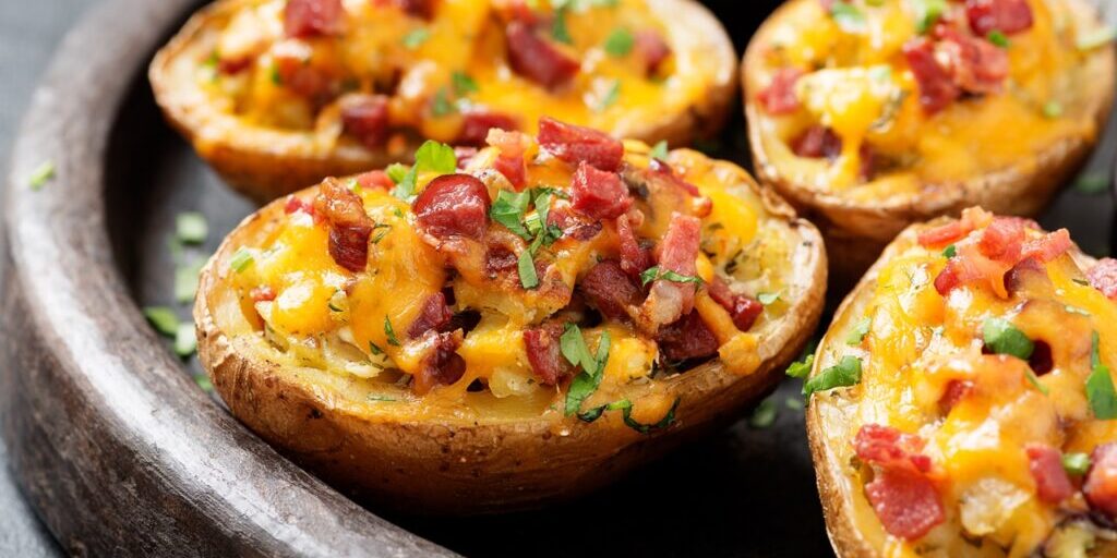 Hot baked potato topped with bacon, green onions and cheddar cheese.