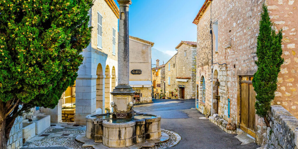 GOURDON, FRANCE - OCTOBER 31, 2014: Medieval street with a fountain in the village