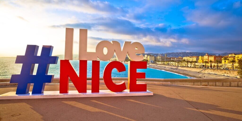 Nice, France, January 17, 2019: I love Nice tourist sign above Promenade des Anglais in city Of Nice, famous tourist destination on Cote d Azur, France. Sunset view,